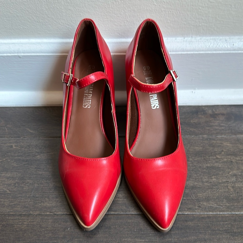 Red pointy toe pumps